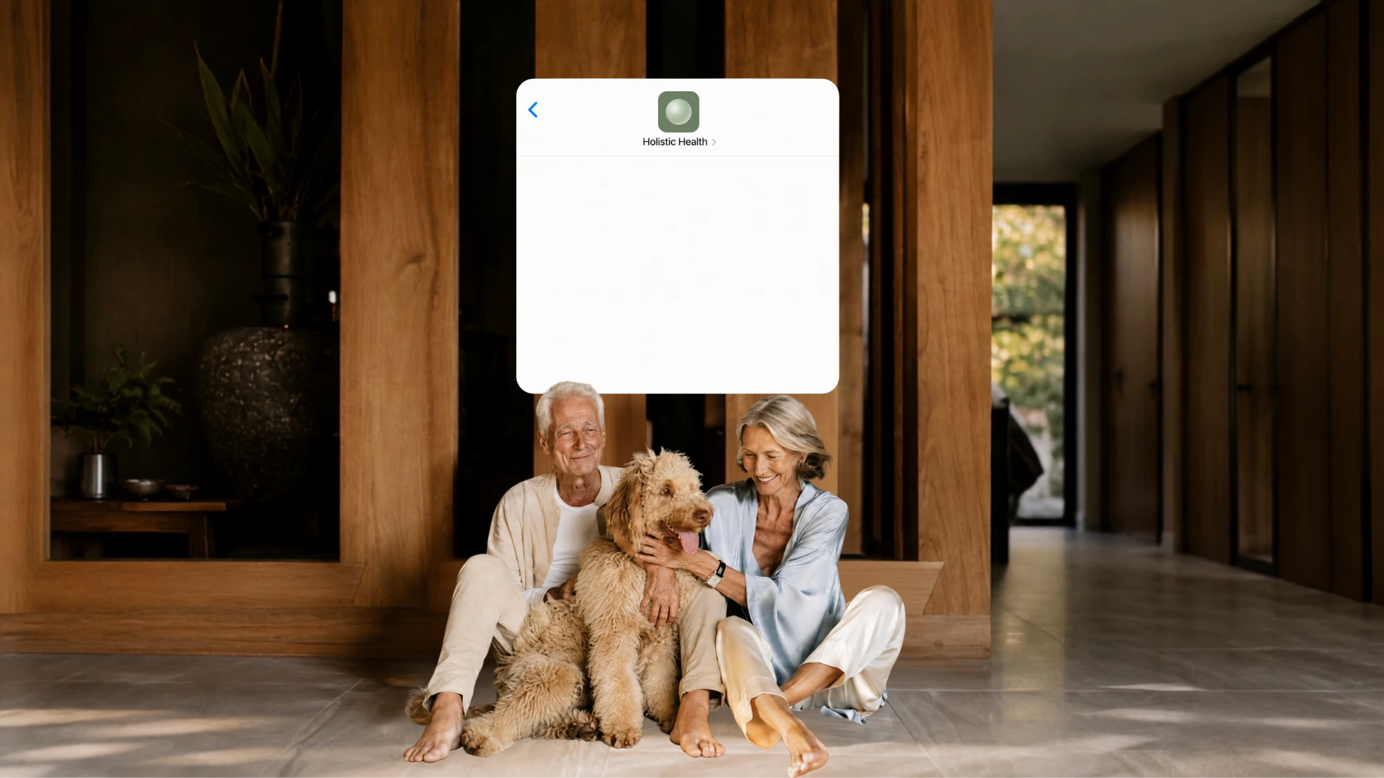 An older couple at home with their dog, a Holistic Health conversation floating above them
